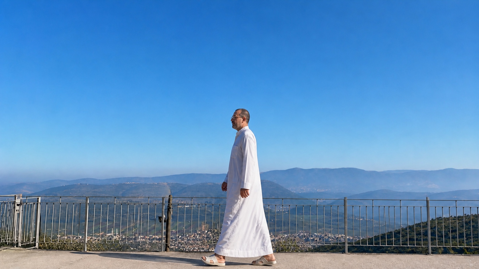 AI-reconstructed wide morning view of Natti walking in a white galabia along a Hararit ridge above the Galilee.