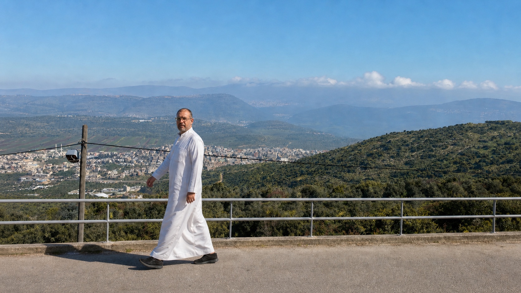 AI-reconstructed panel of Natti walking beside a railing with the Galilee valley spread behind him.